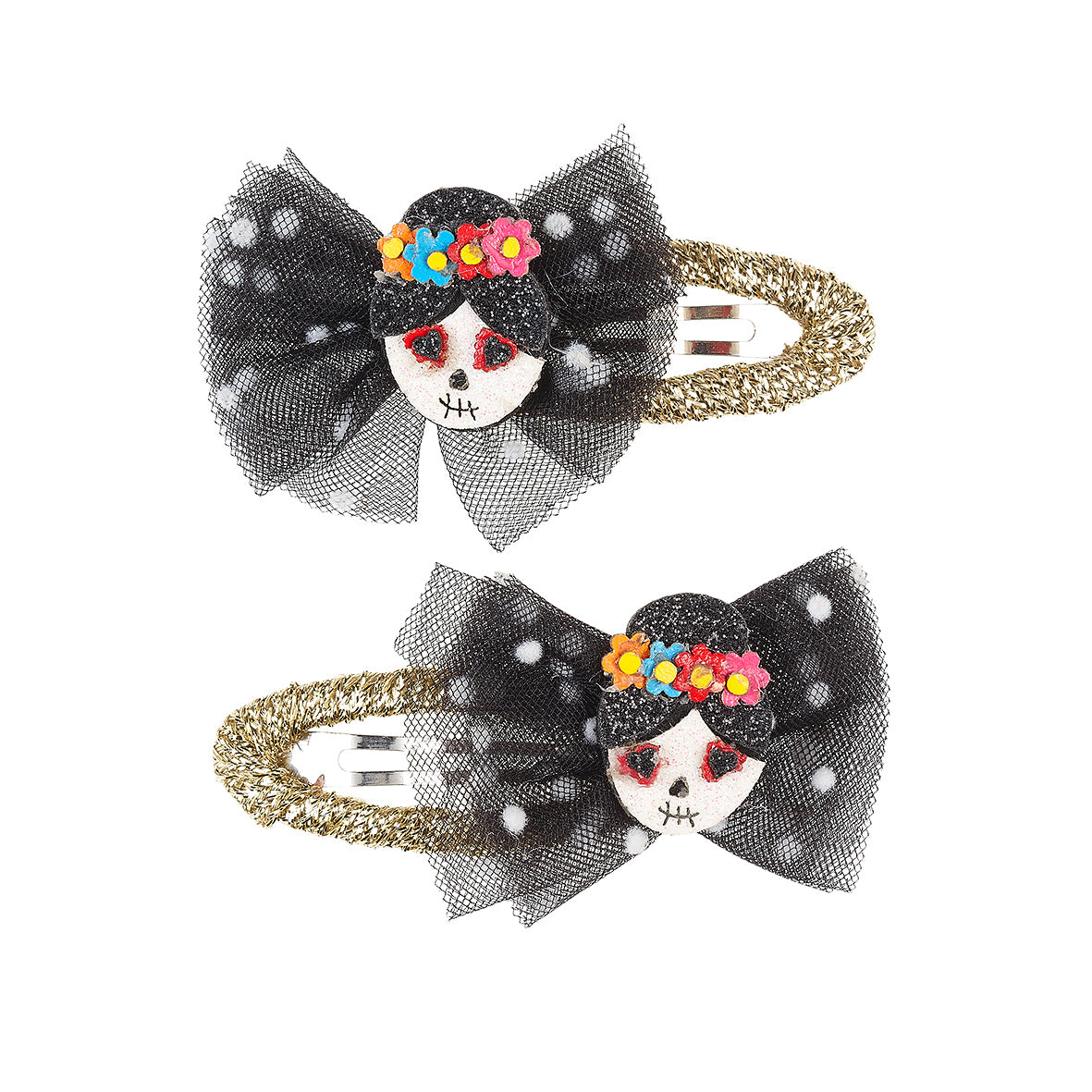 Two decorative hair clips with skull designs and colorful flowers on a white background by Souza!