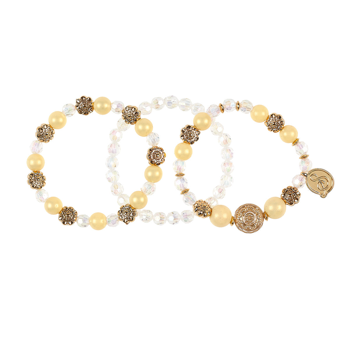 Set of three beaded bracelets with gold and beige beads on a white background